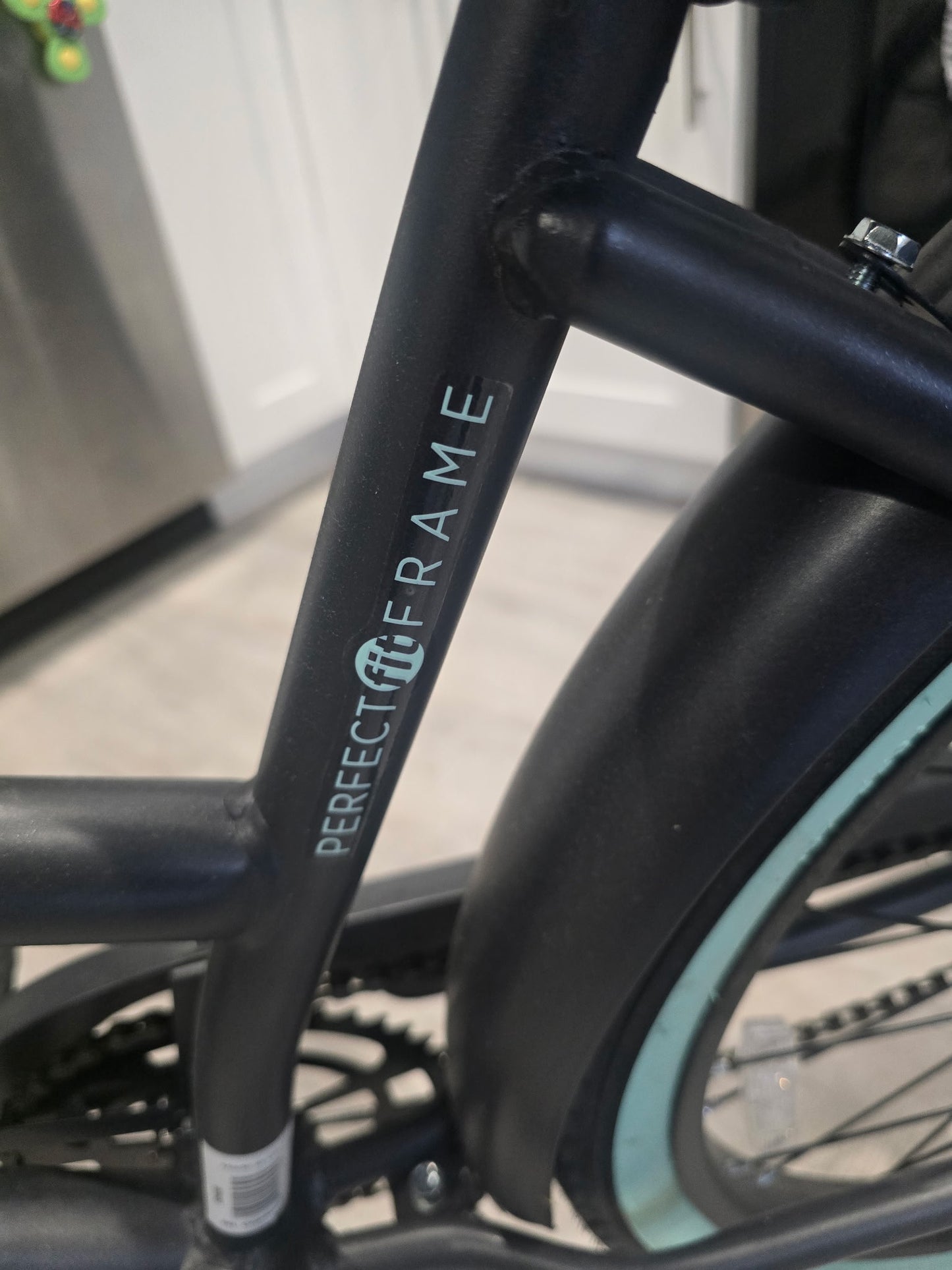 Huffy 26-inch Cranbrook comfort cruiser bike in gray with mint green accents.
