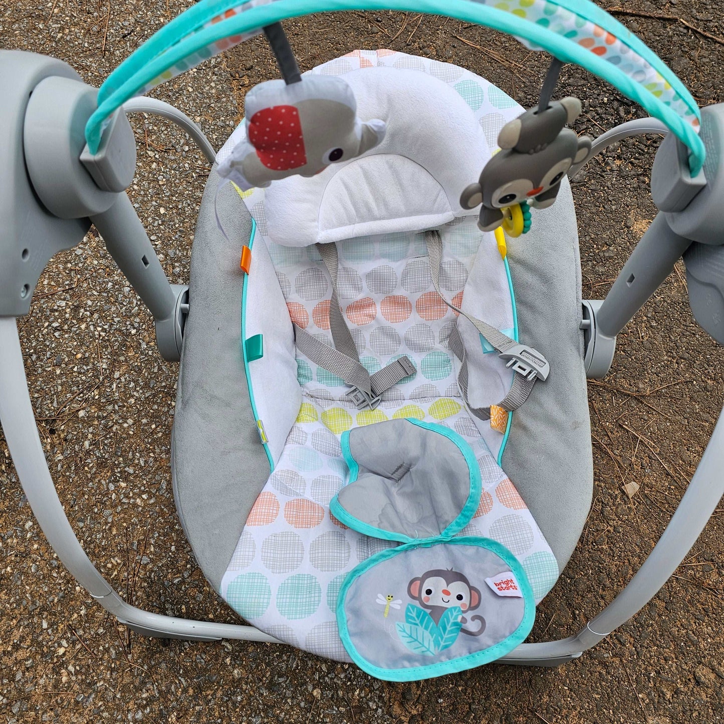 Bright Starts Whimsical Wild portable compact baby swing with animal toys and colorful cushions