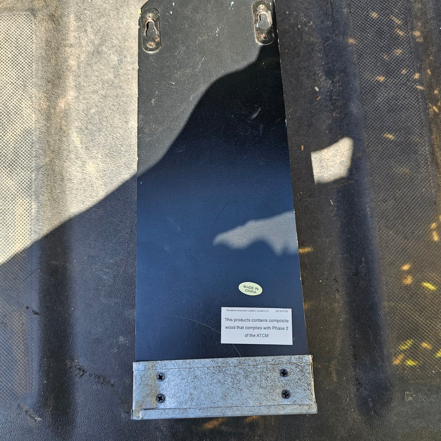 Wall-mounted bottle opener with a cap catcher