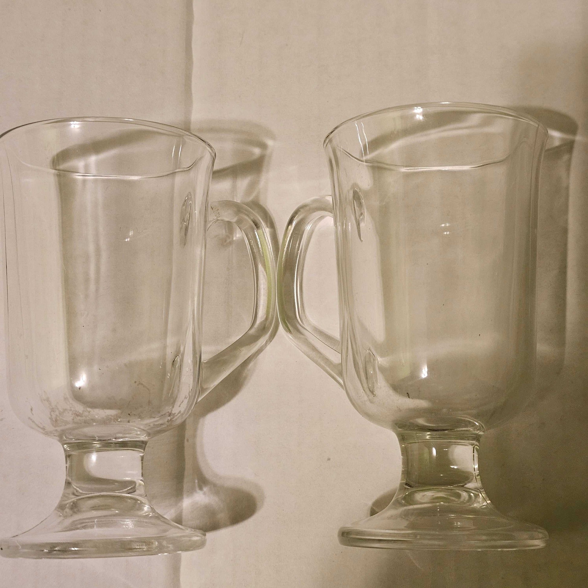 Set of 2 French-made clear glass Irish coffee mugs with handle and pedestal base