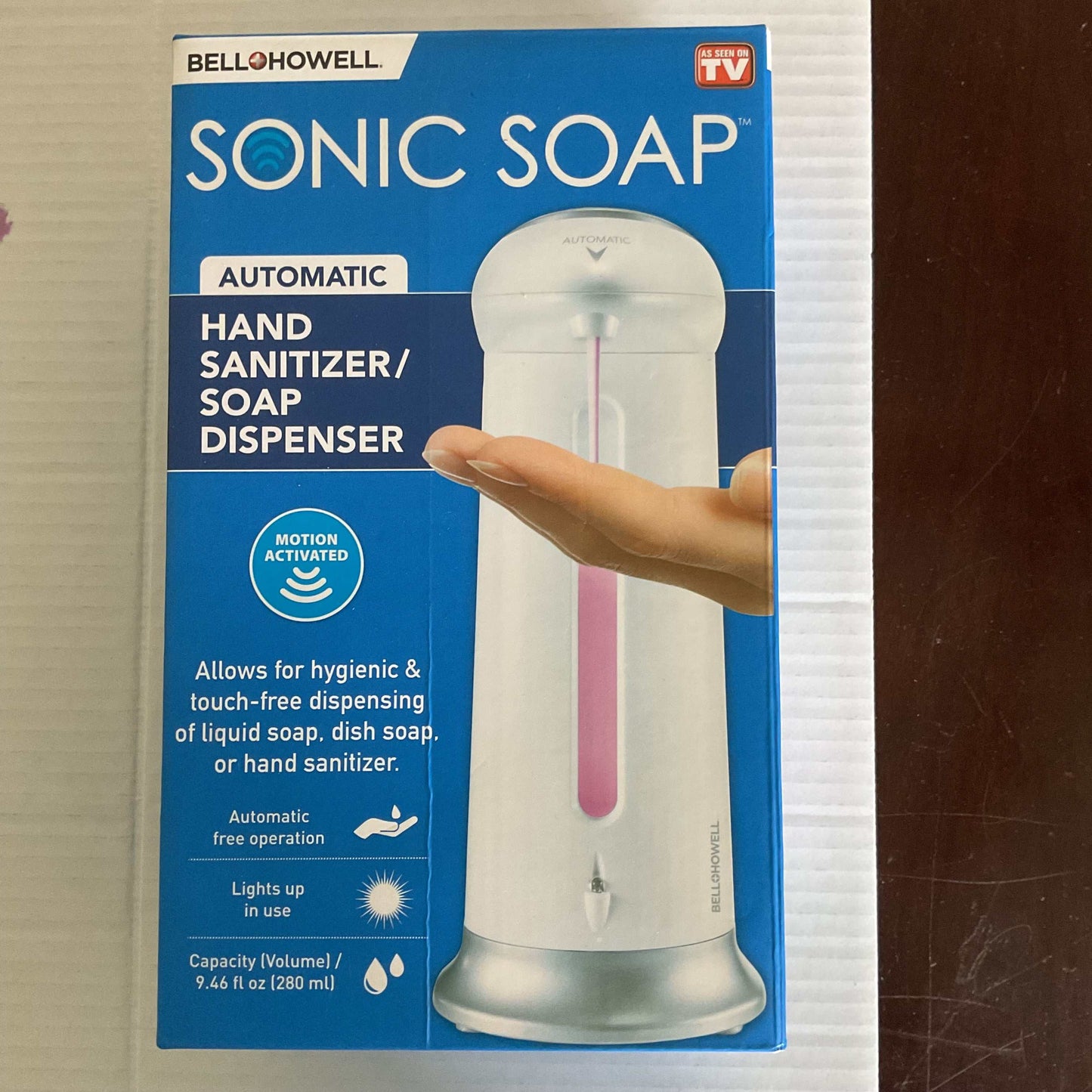 Bell+Howell Sonic Soap automatic motion-activated touch-free soap and hand sanitizer dispenser with 9.46 fl oz capacity and light-up feature.