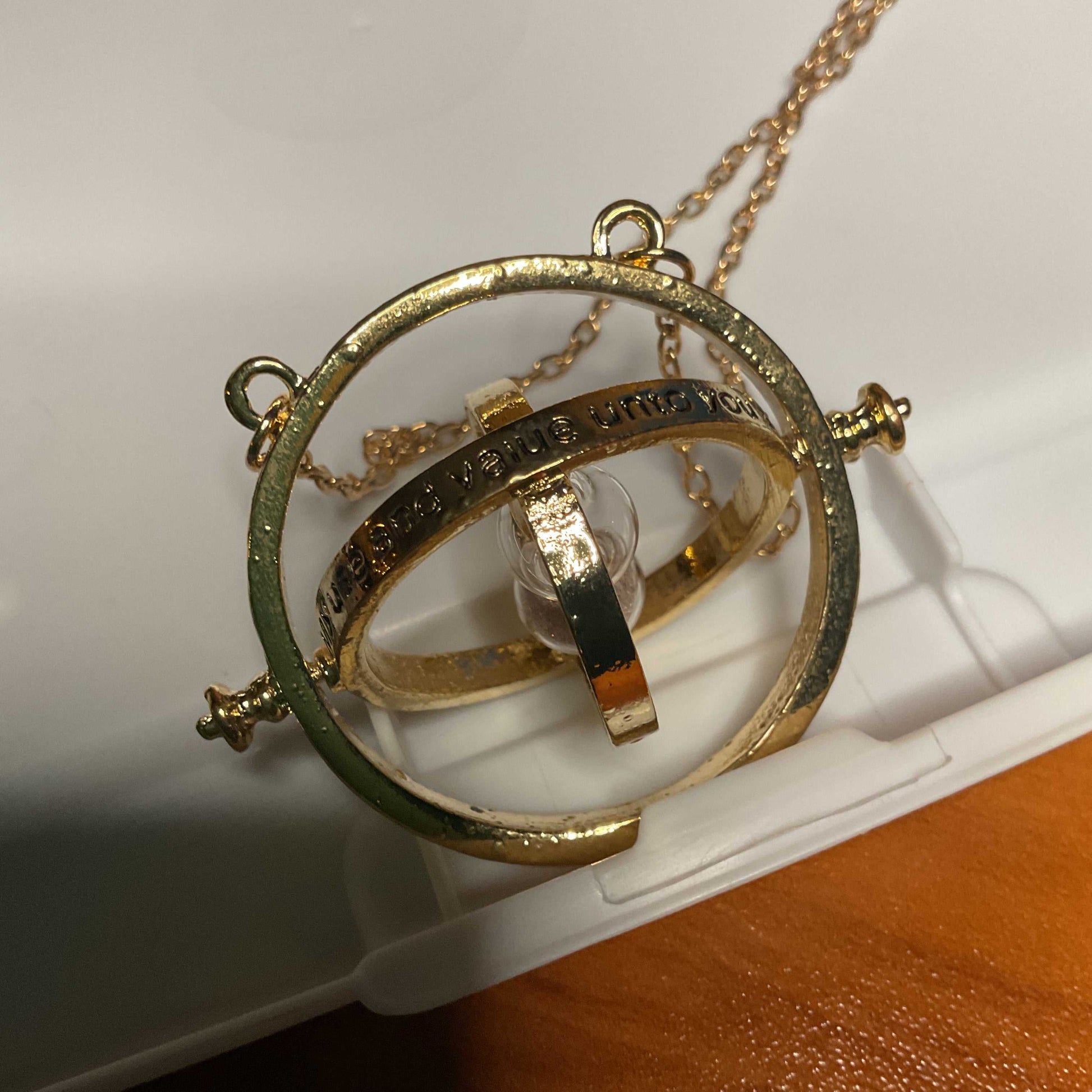 Harry Potter Hermione Grangers Time Turner gold necklace with rotating rings and clear center stone