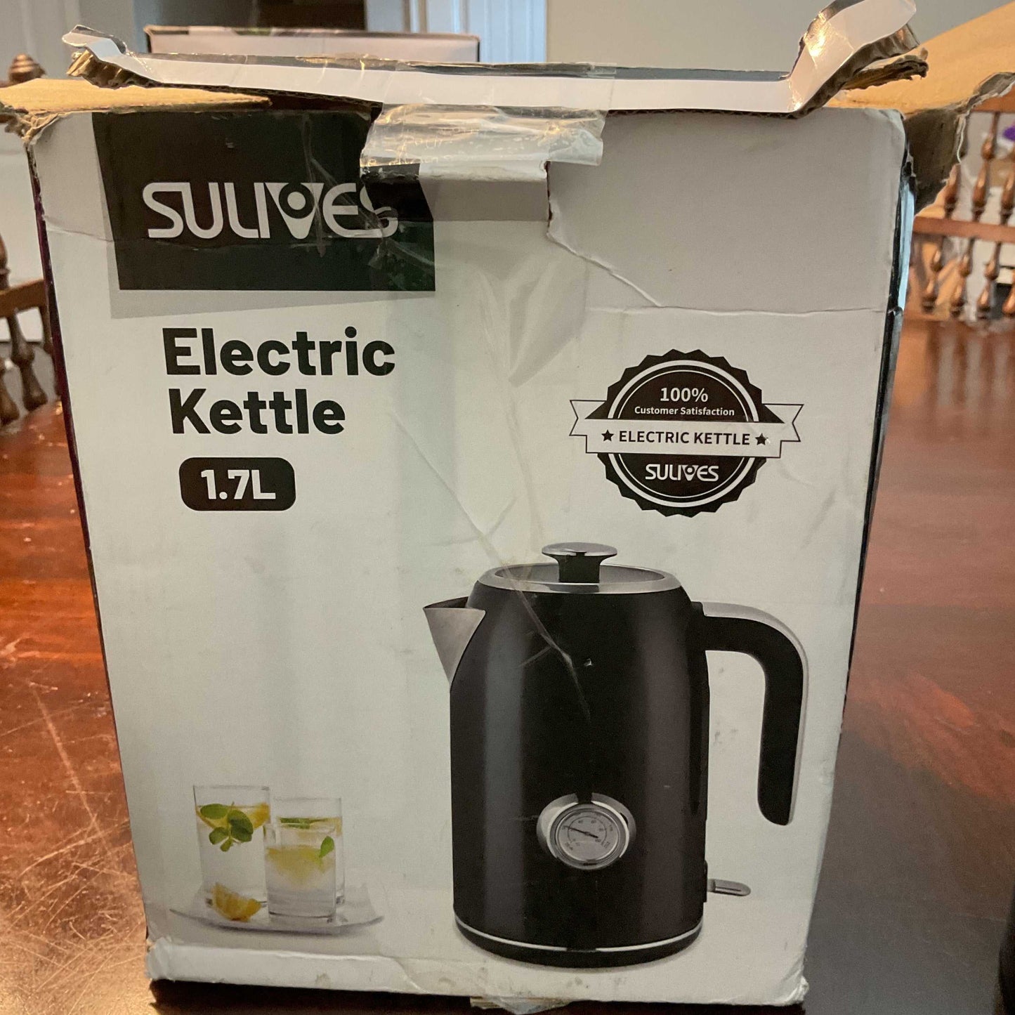 Sulives Electric Kettle 1.7L black with temperature gauge and stainless steel interior on packaging box