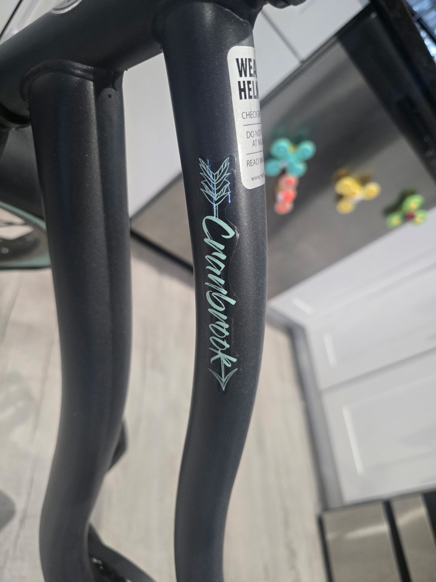 Huffy 26-inch Cranbrook comfort cruiser bike in gray with mint green accents.