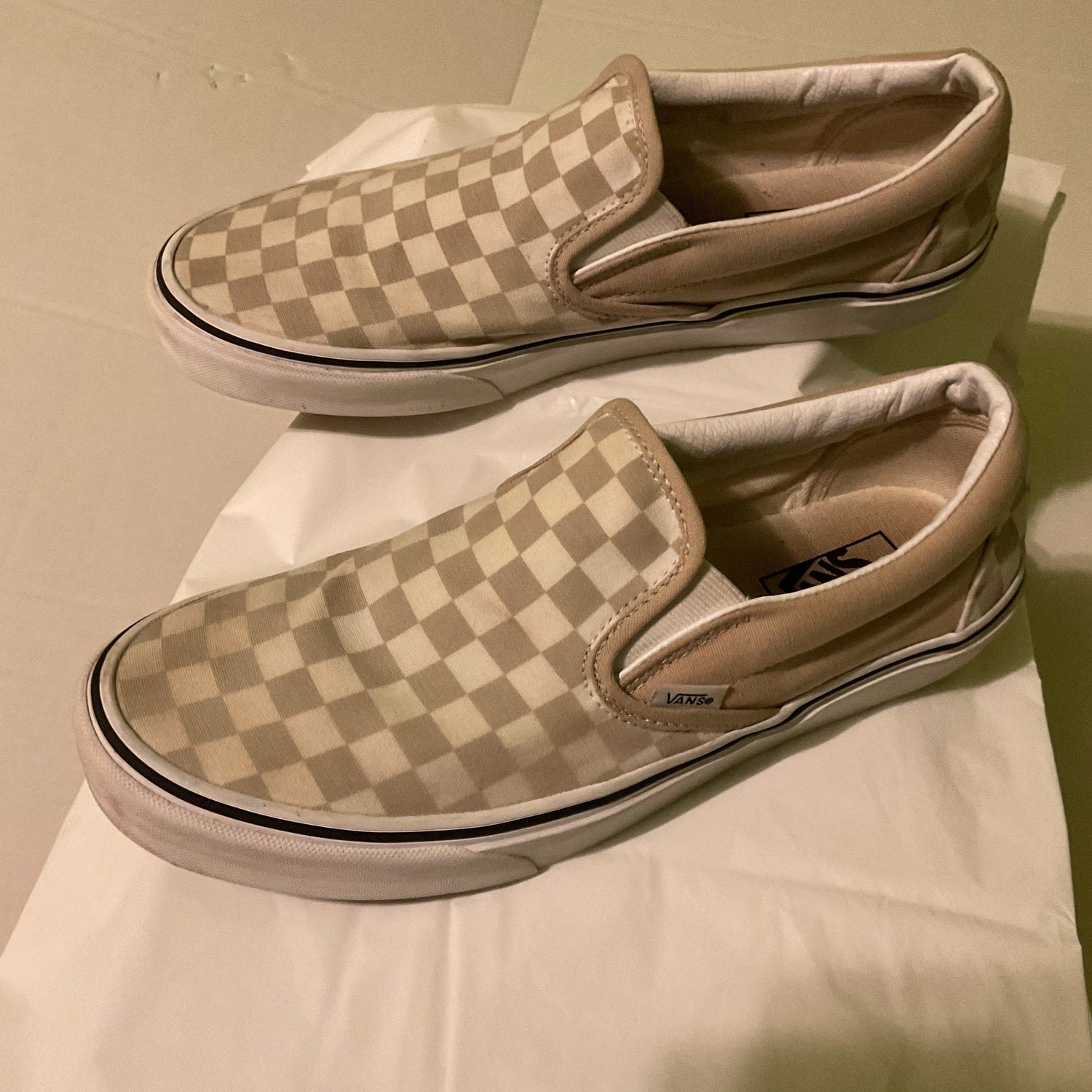 Beige and white checkerboard Vans Slip-On Shoes with canvas upper and vulcanized rubber sole, men's size 10 women's 11.5