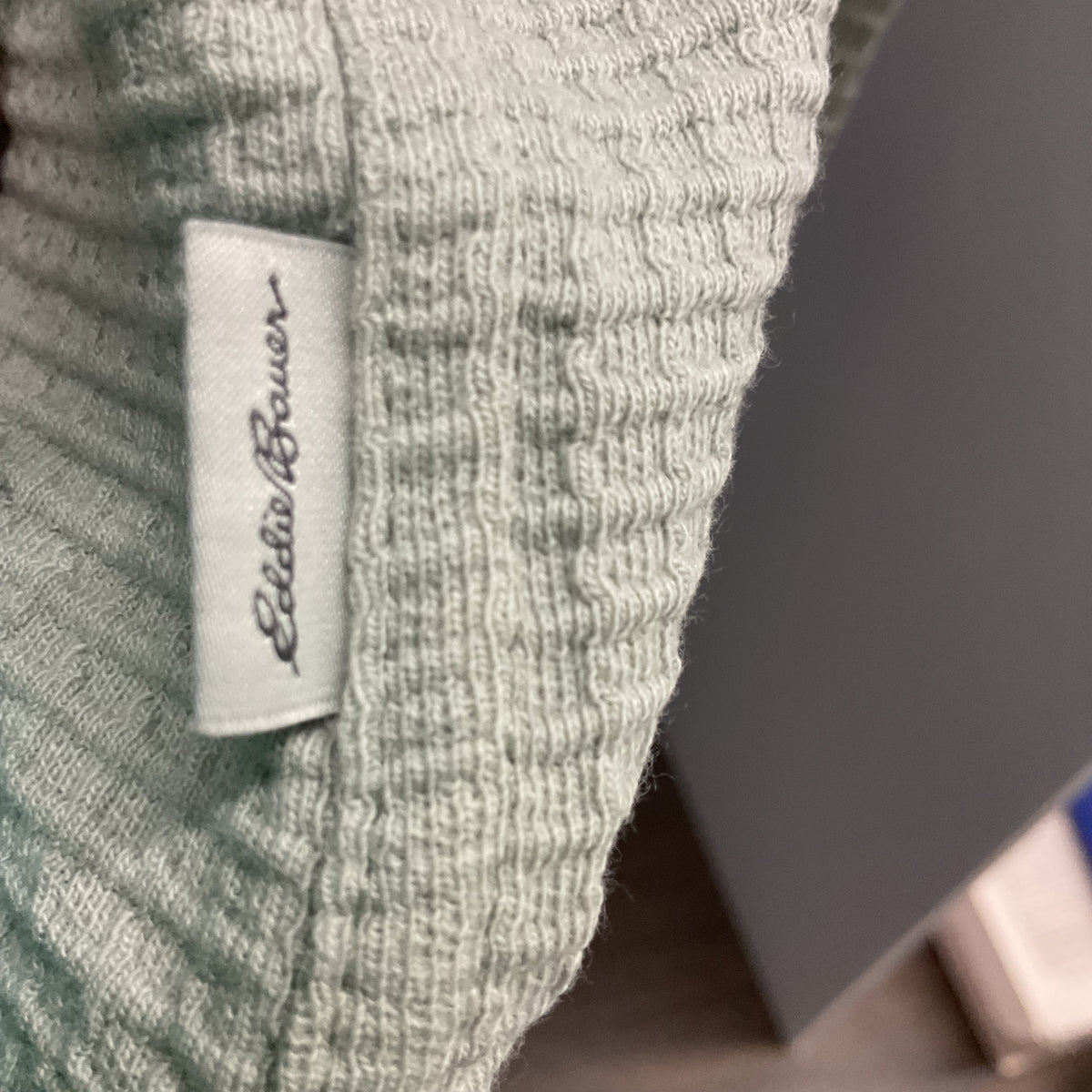 Eddie Bauer women's waffle knit button-down shirt in a light sage green color.