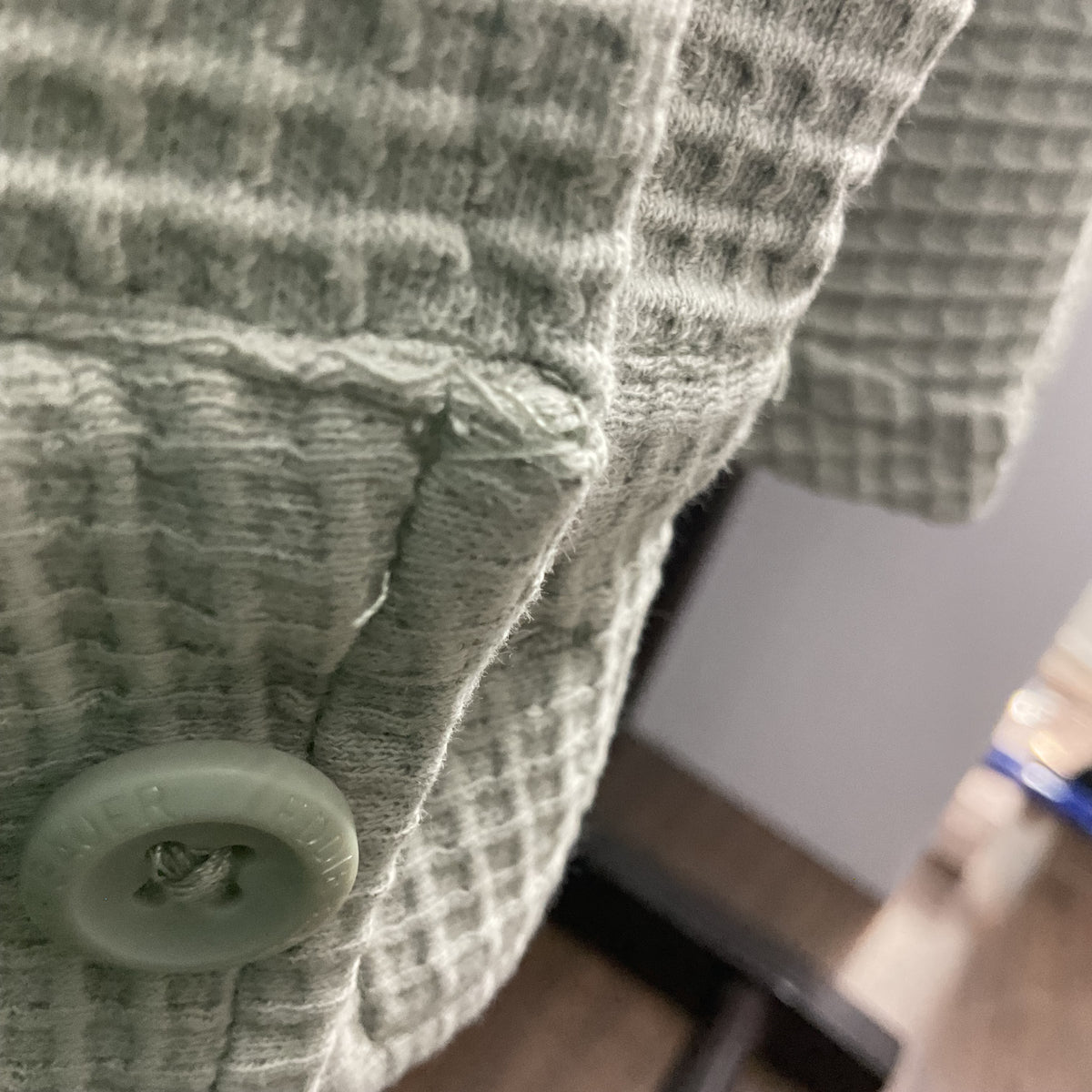 Eddie Bauer women's waffle knit button-down shirt in a light sage green color.