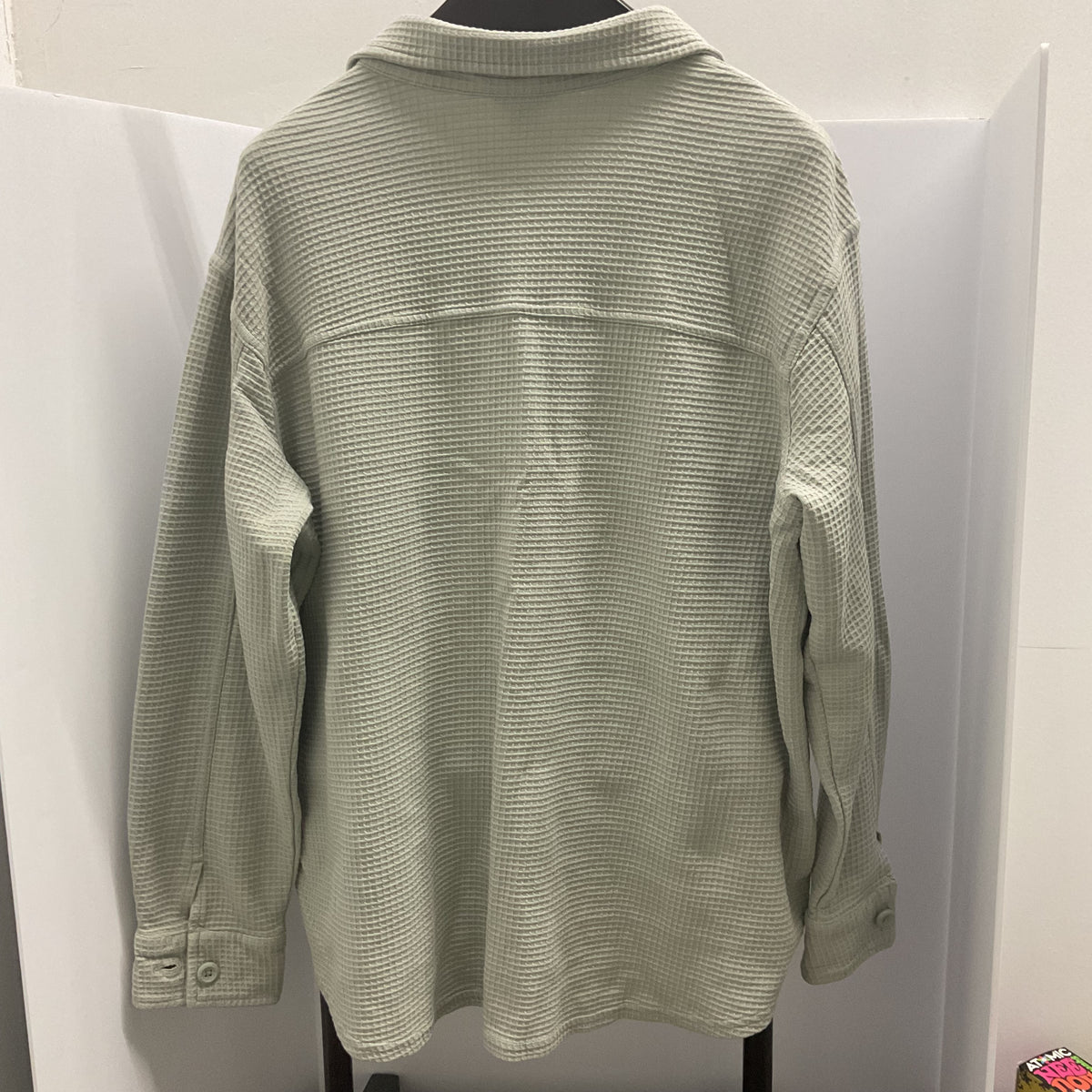 Eddie Bauer women's waffle knit button-down shirt in a light sage green color.
