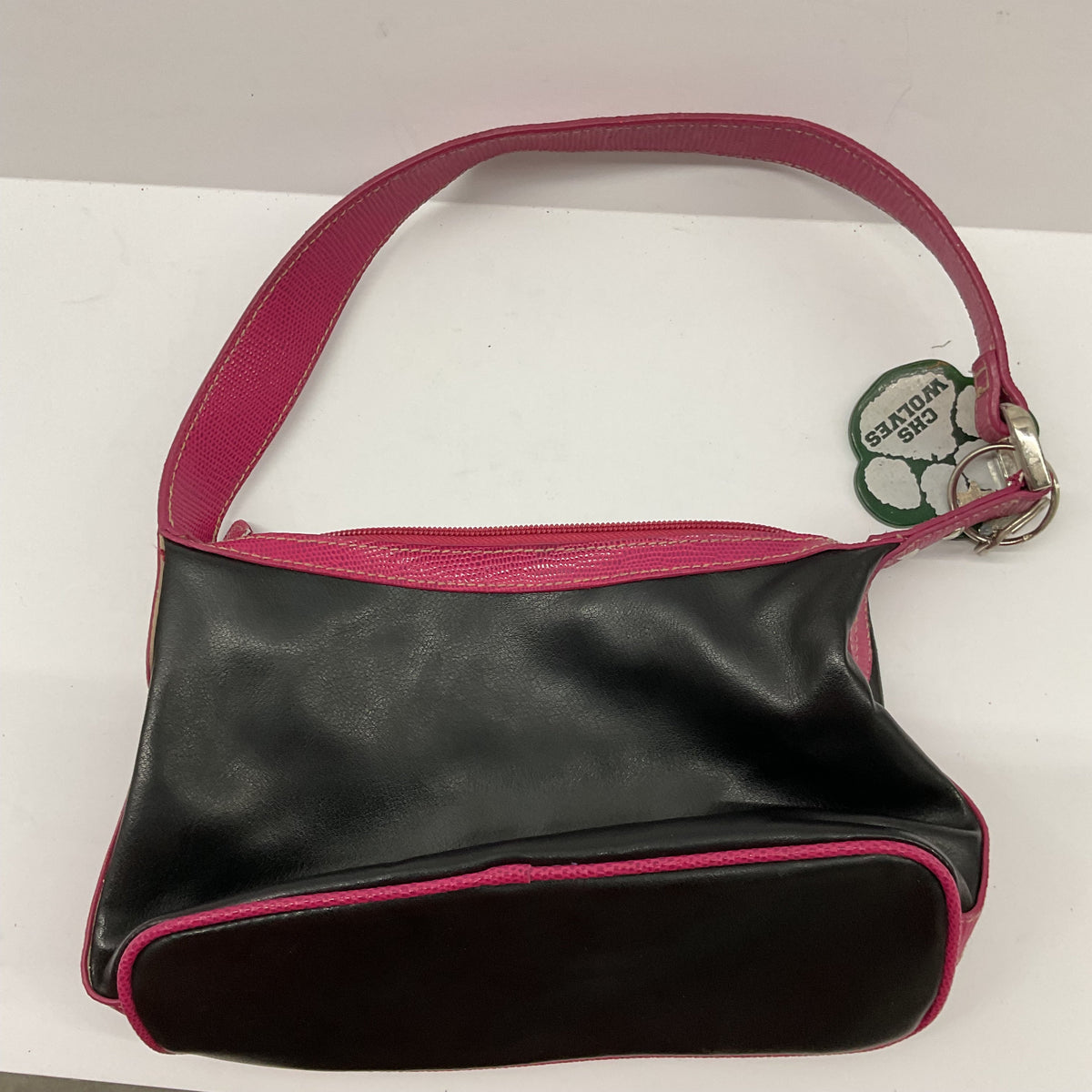Garage Sale Unlimited small black shoulder handbag with vibrant pink trim and a CHS Wolves paw print charm