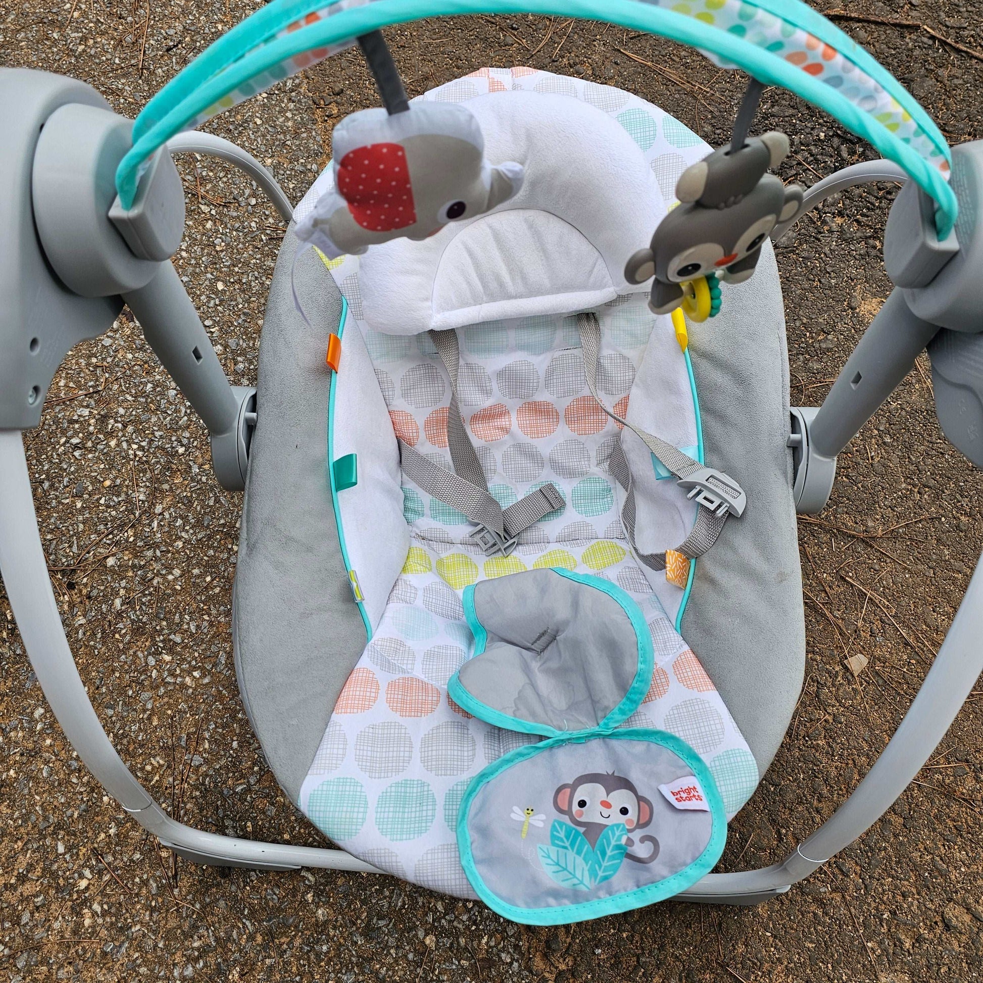 Bright Starts Whimsical Wild portable compact baby swing with animal toys and colorful cushions